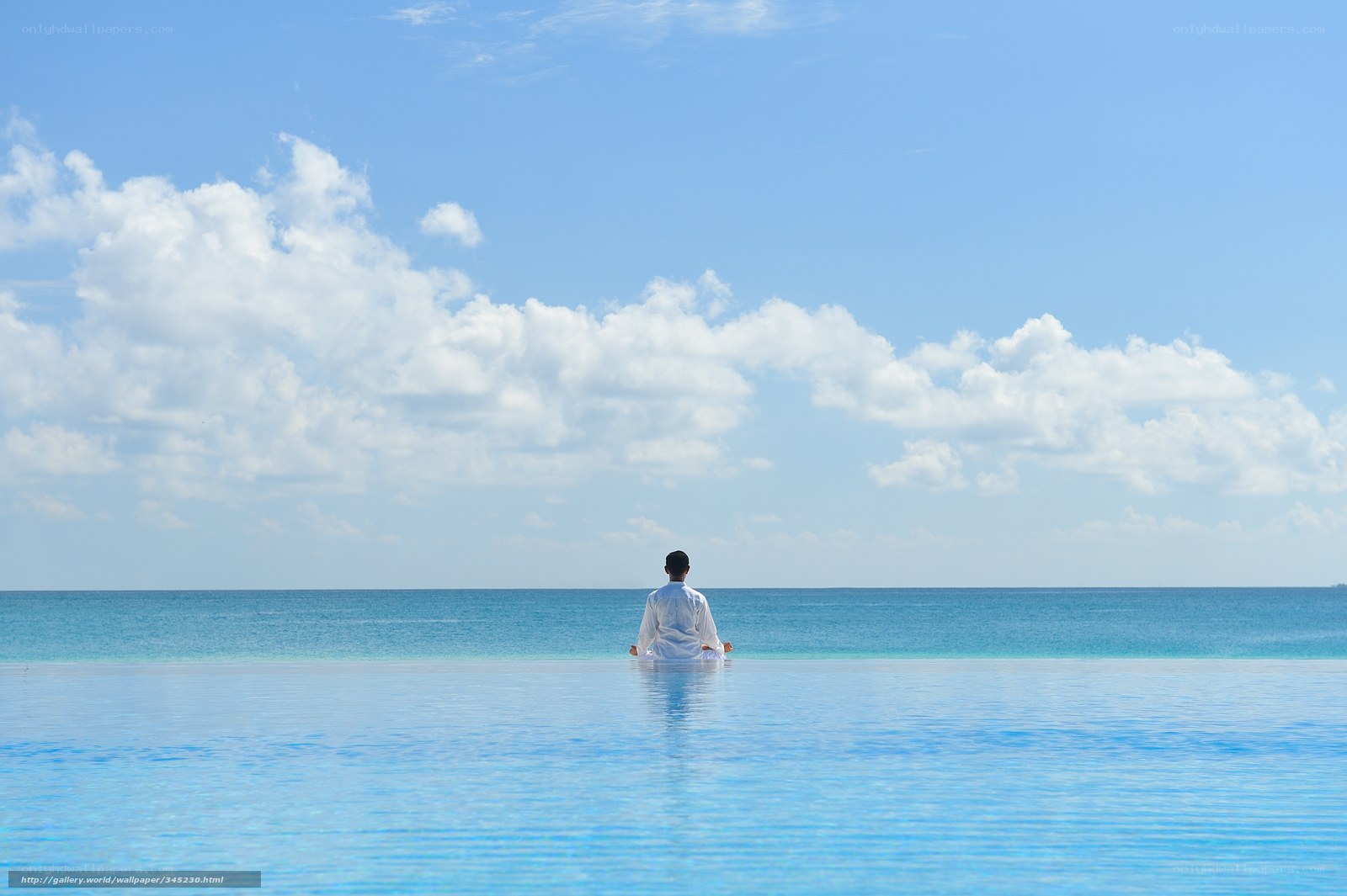 Man meditating by the ocean