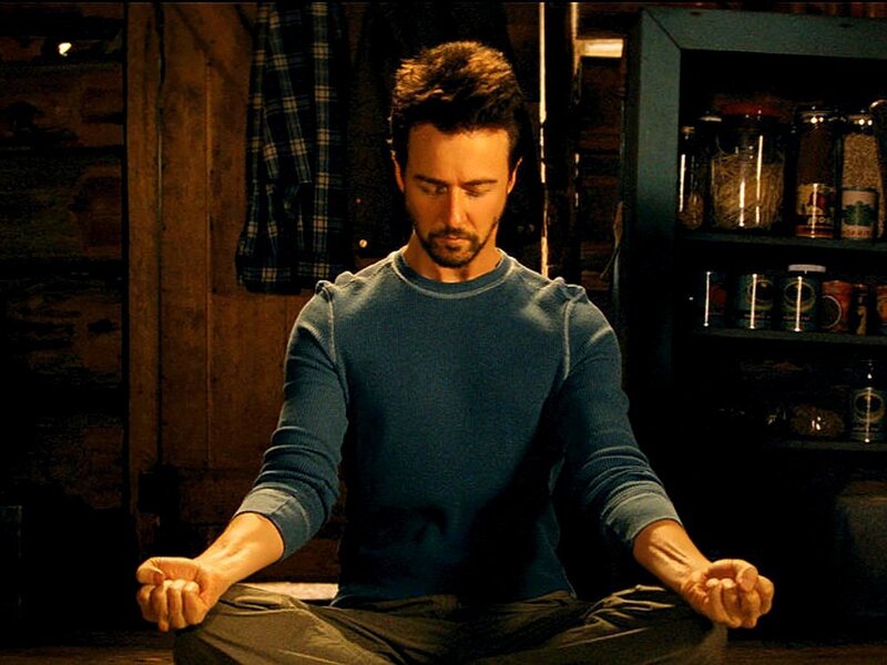man meditating in a room