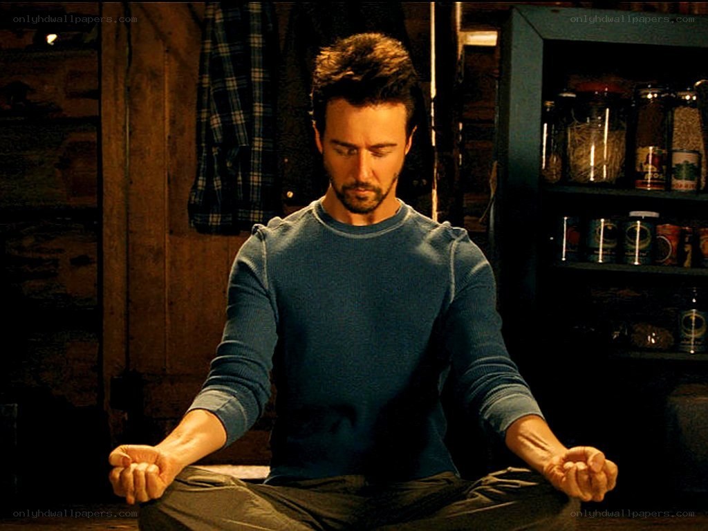 man meditating in a room