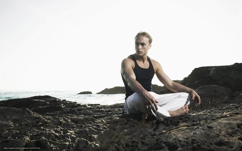 Man Meditating on Rocks
