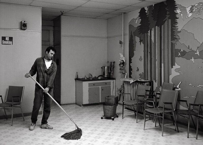 Man mopping a room