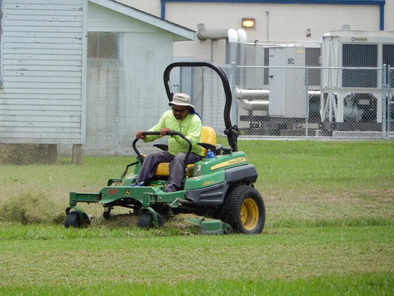 Man Mowing Lawn