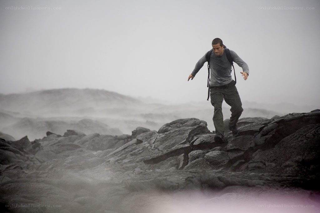 man navigating volcanic terrain