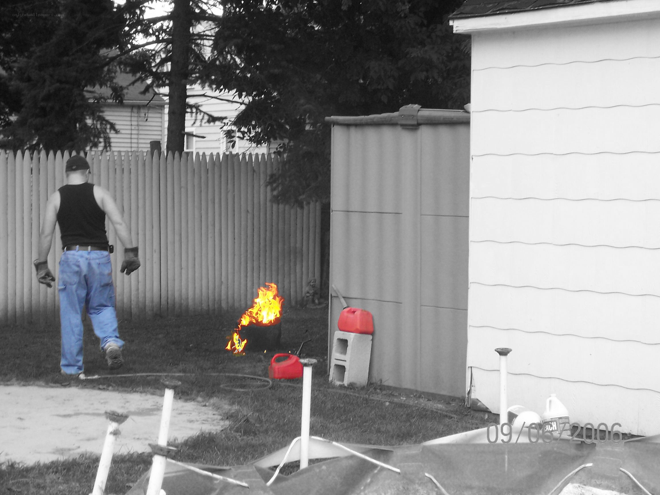 Man near burning barrel