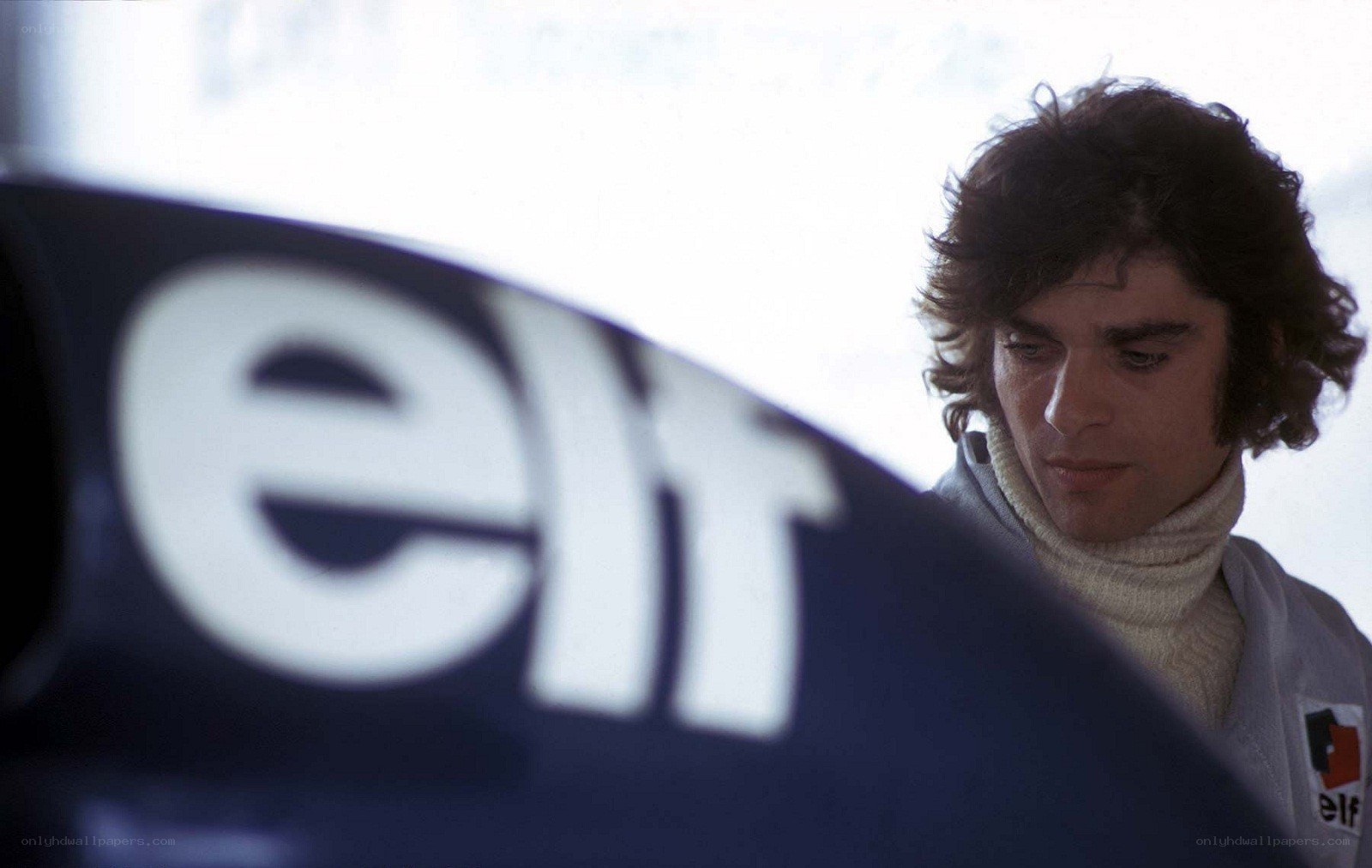 man near car with elf logo