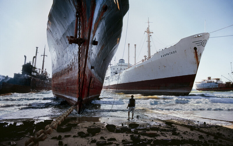 Man Near Ships on Beach