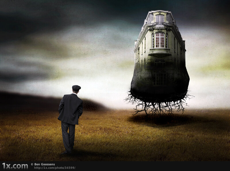 Man observing floating house