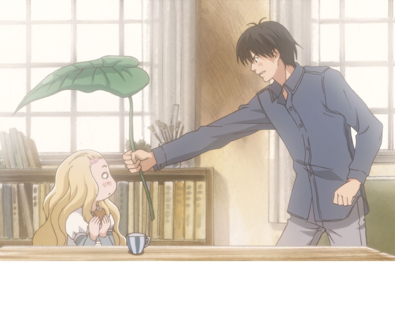 man offering leaf to girl