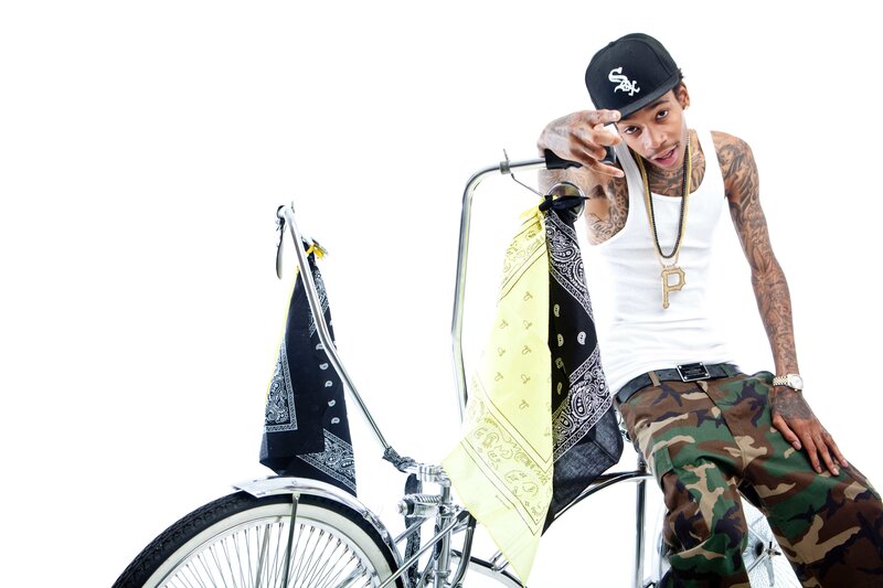 Man on a bicycle with bandanas