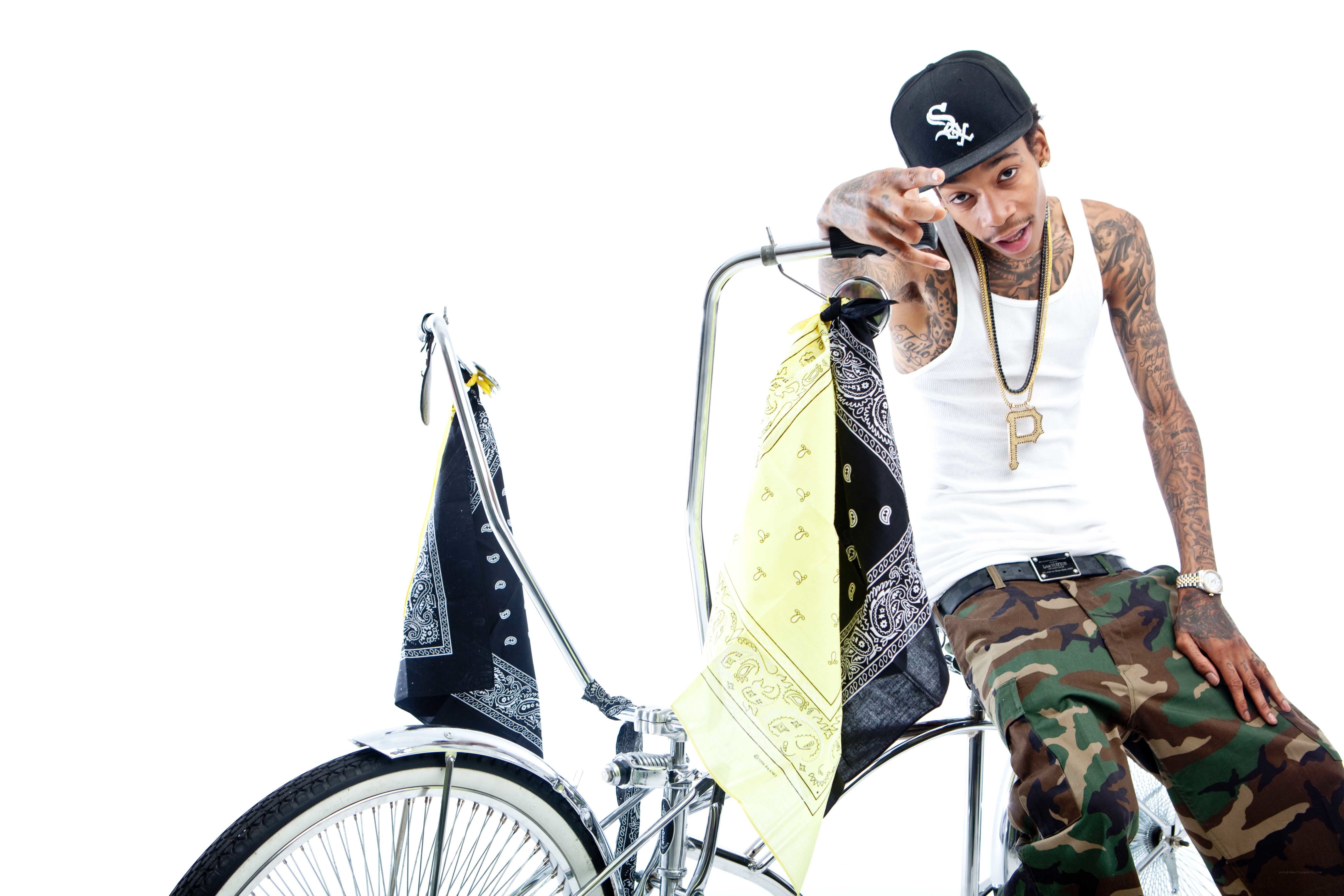 Man on a bicycle with bandanas
