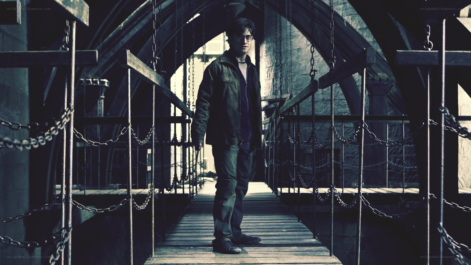 man on a chain bridge