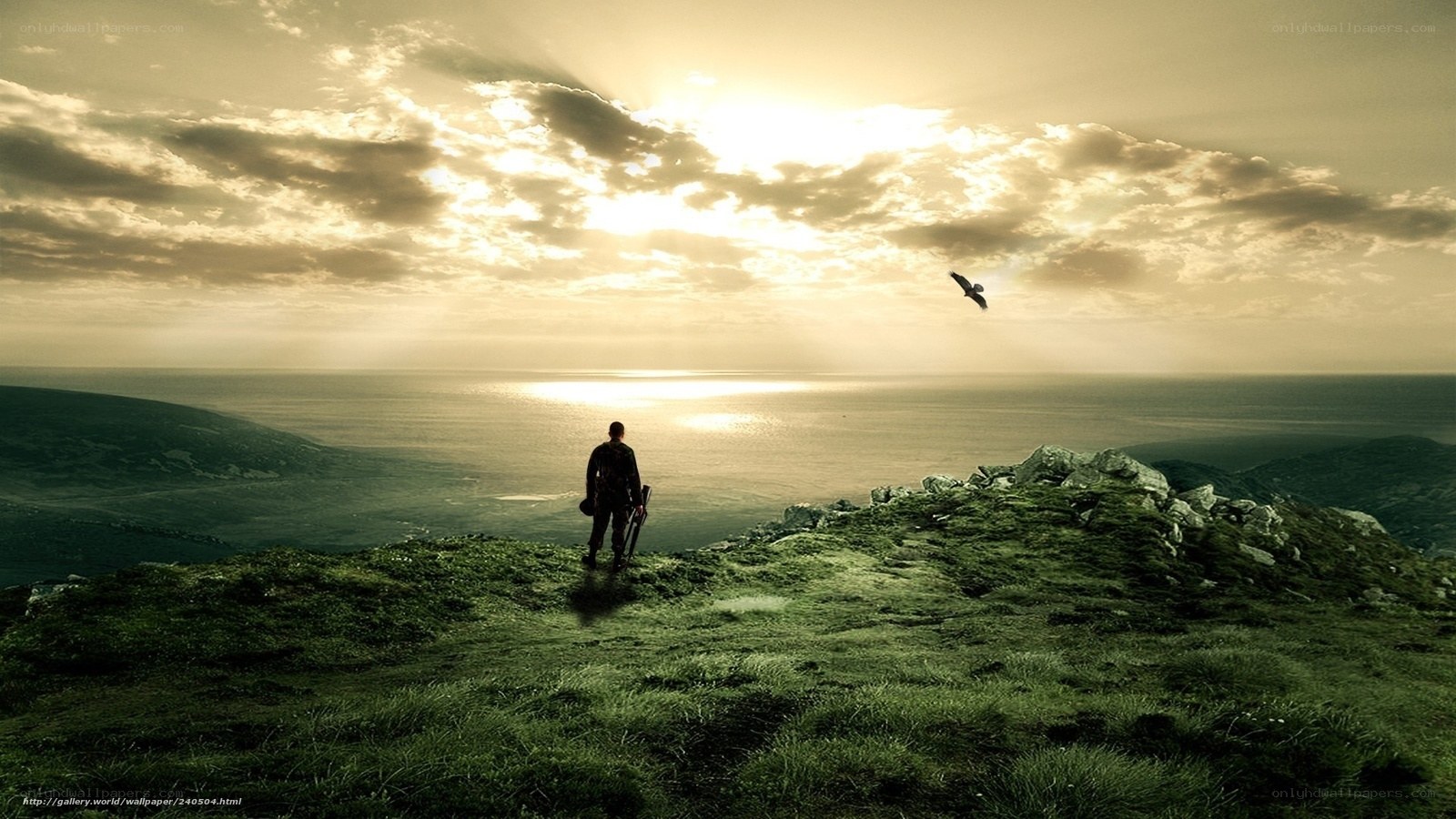 Man on a cliff at sunset