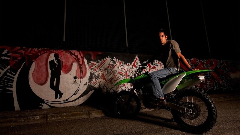 Man on a dirt bike at night