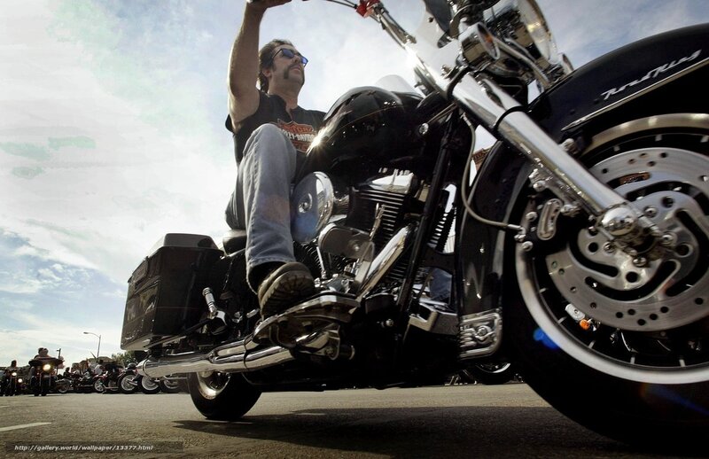 Man on a motorcycle at a rally