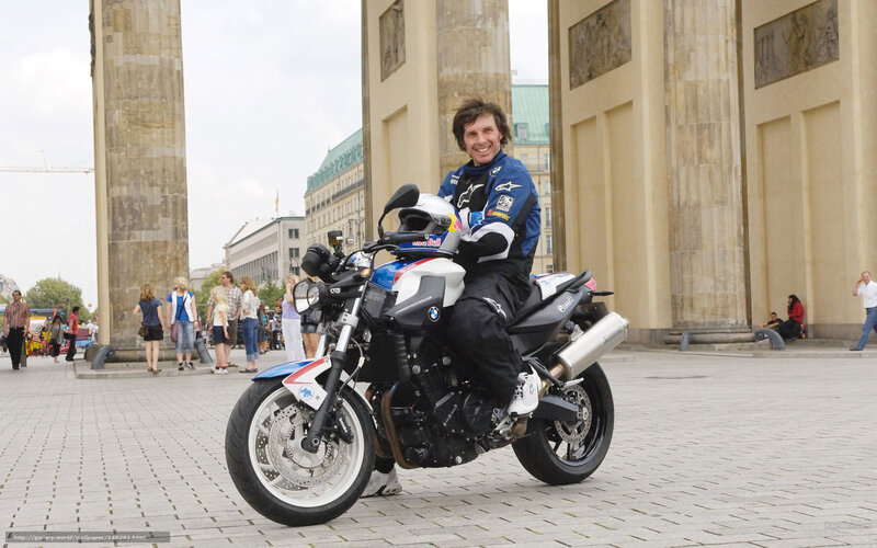 Man on a motorcycle in a city