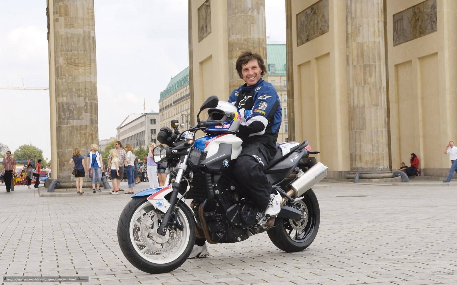Man on a motorcycle in a city