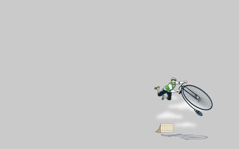 Man on a penny-farthing bicycle
