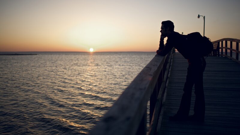 Man on a Pier — Orange, Serene
