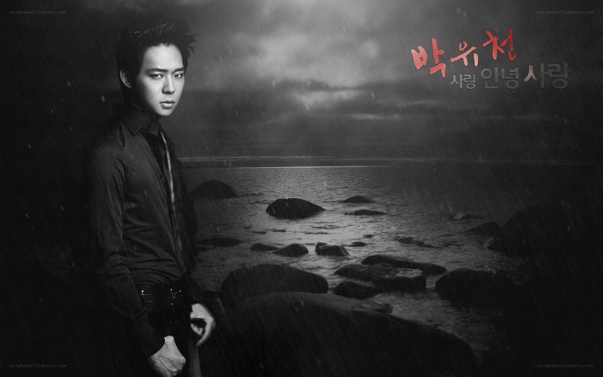 man on a rainy beach