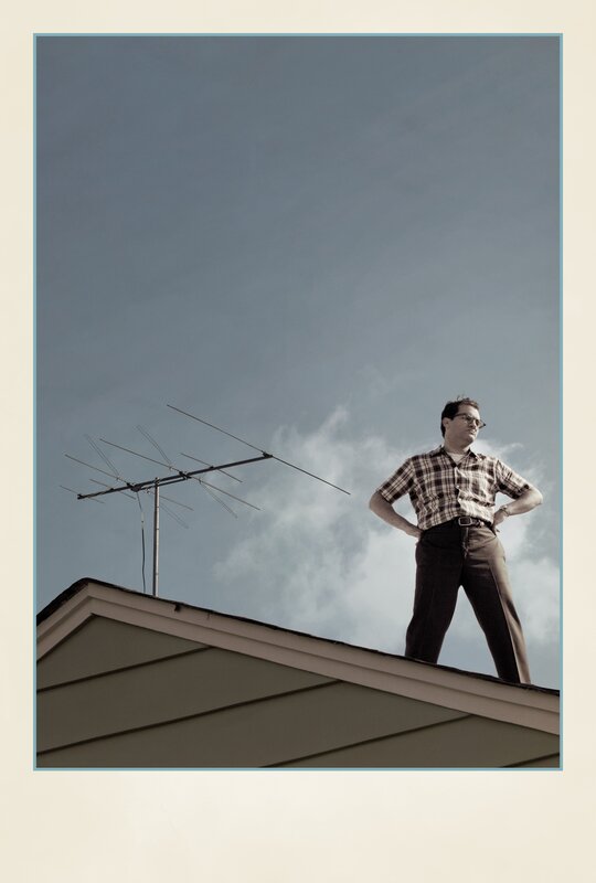 Man on a roof with antenna