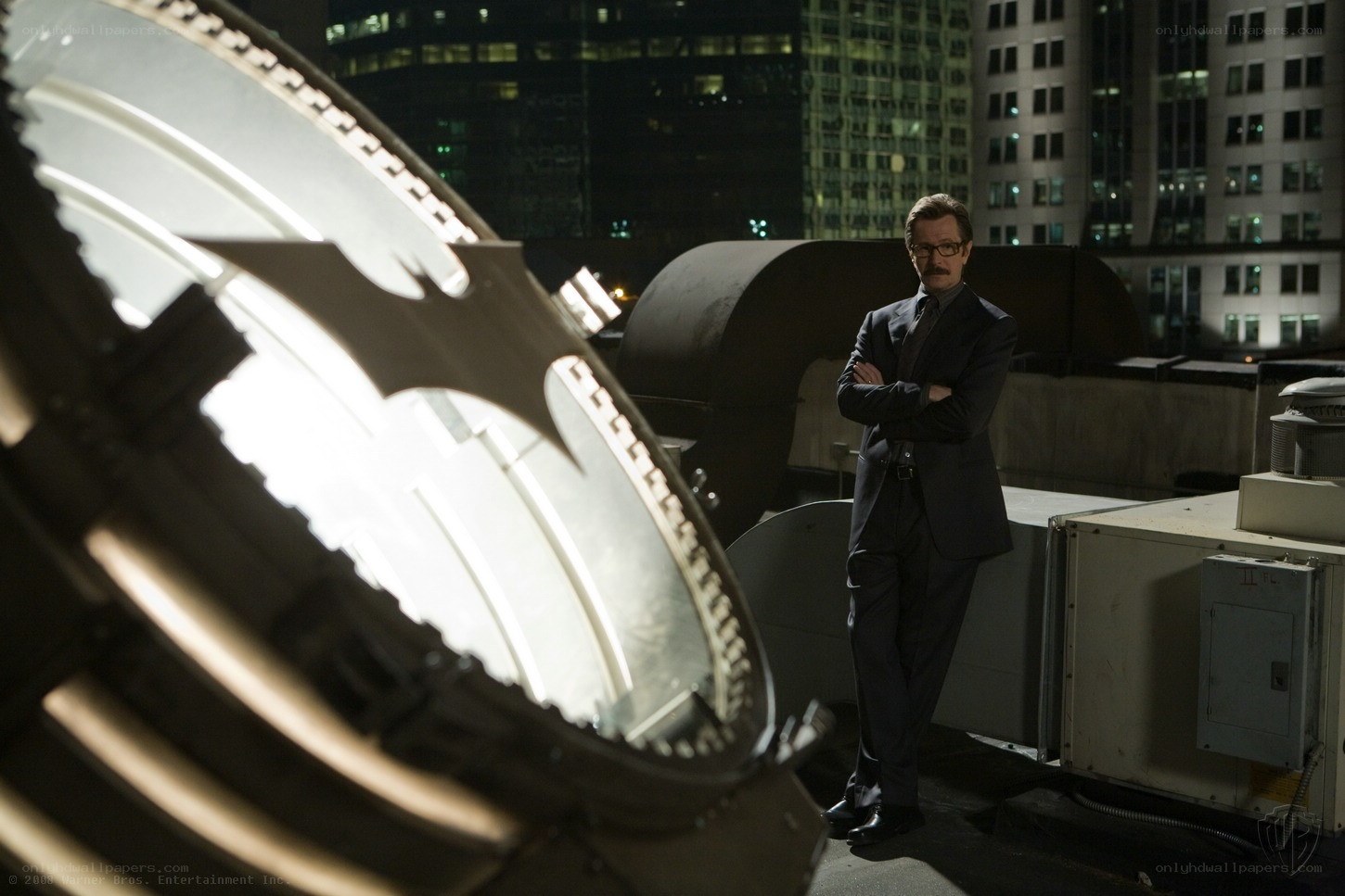Man on a rooftop at night