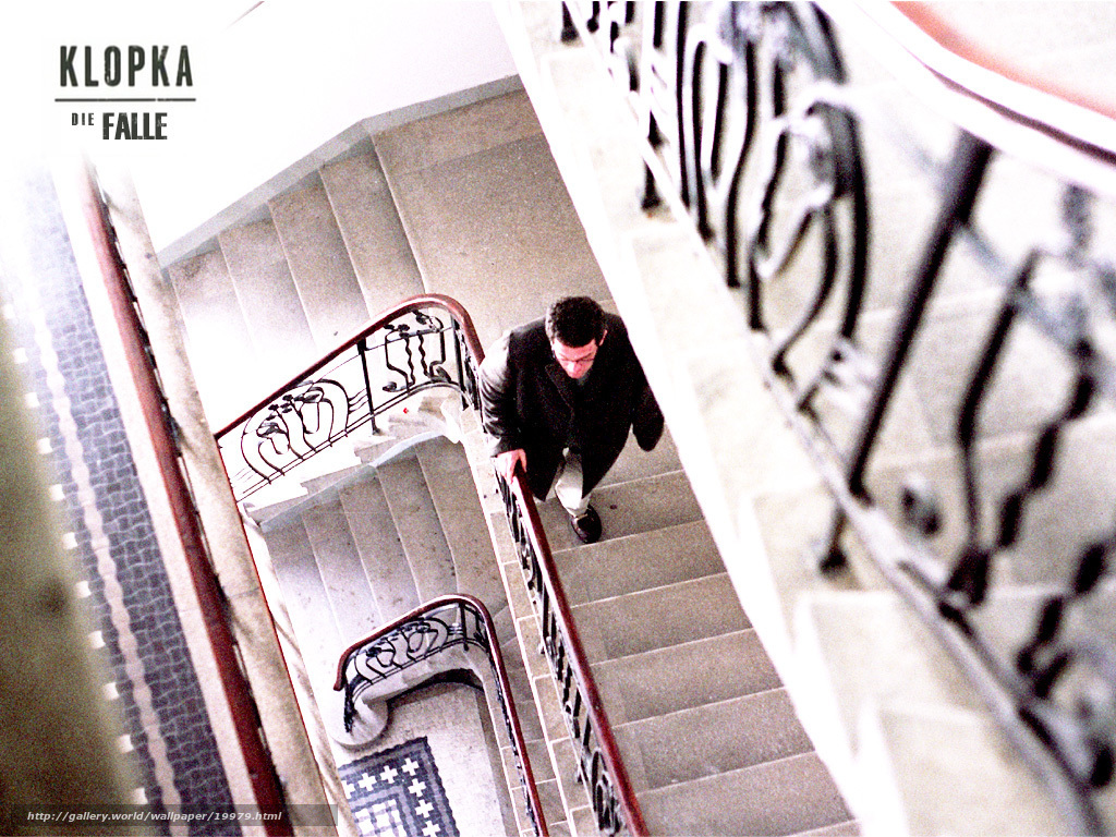 Man on a spiral staircase