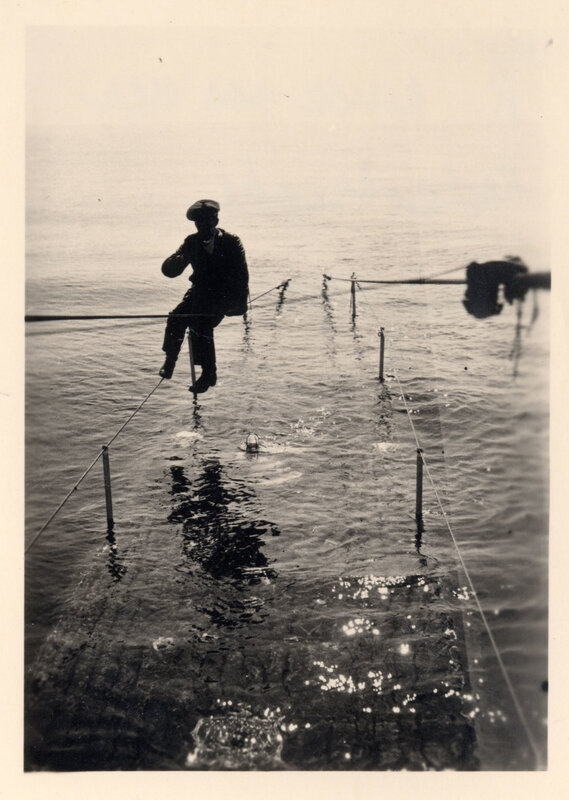 Man on a tightrope over water