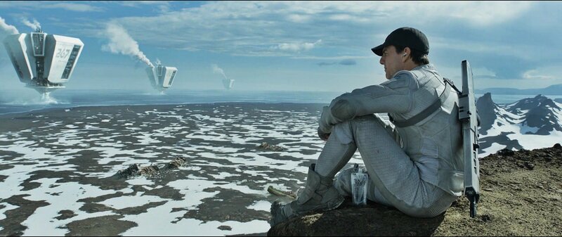 man on alien planet with ships
