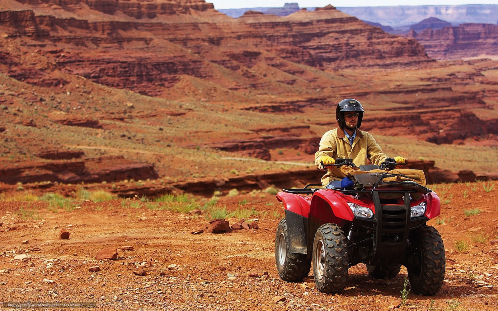 Man on ATV in desert canyon