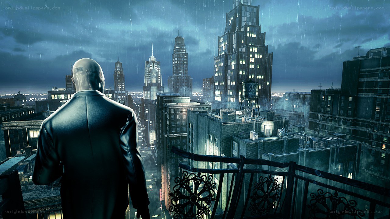 man on balcony overlooking city