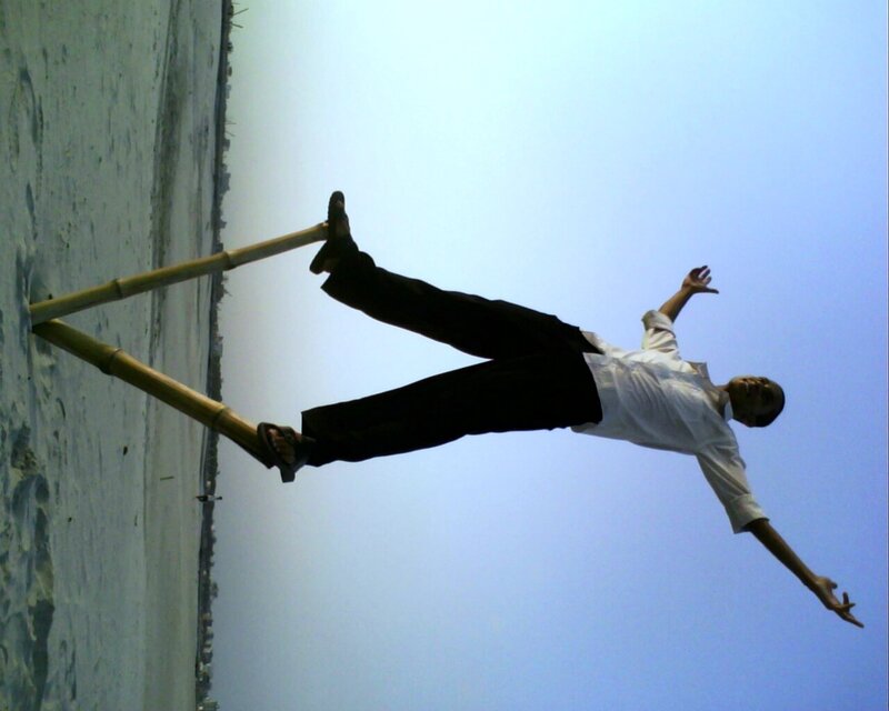 Man on Bamboo Poles