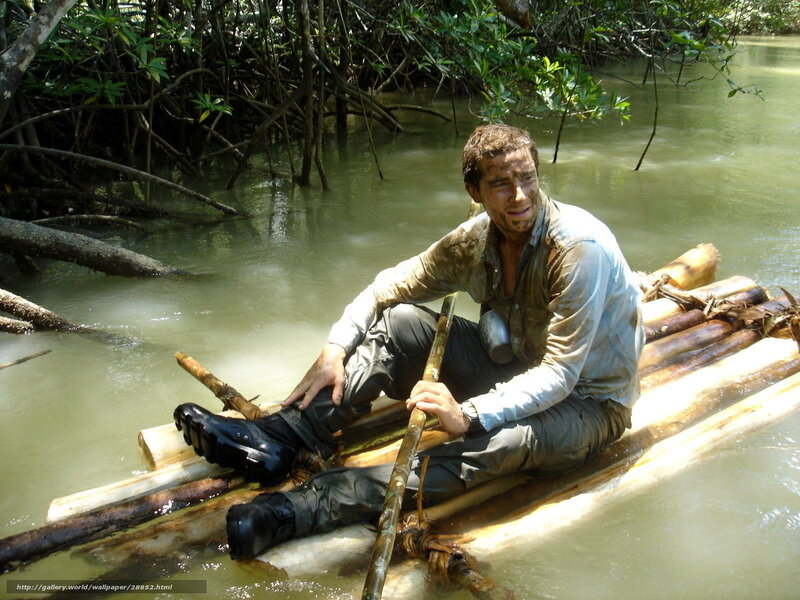 man on bamboo raft