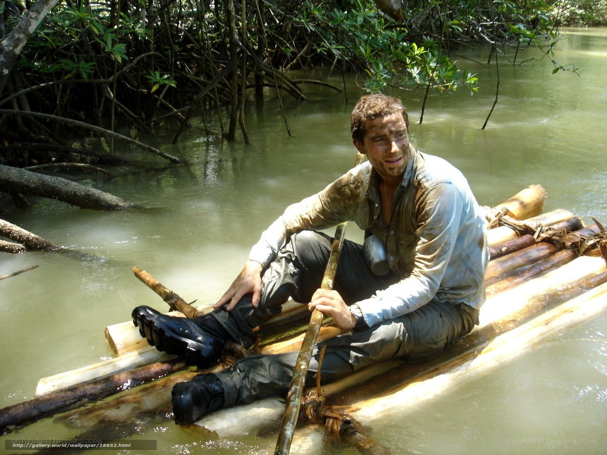 man on bamboo raft