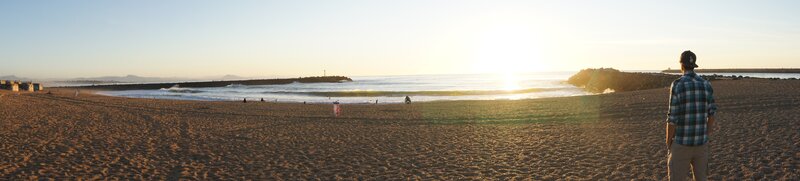 Man on beach at sunset