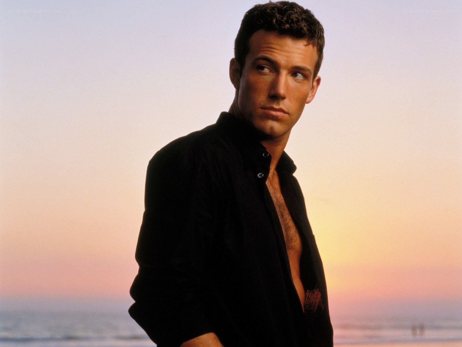 man on beach at sunset