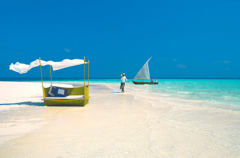 Man on Beach with Sailboat