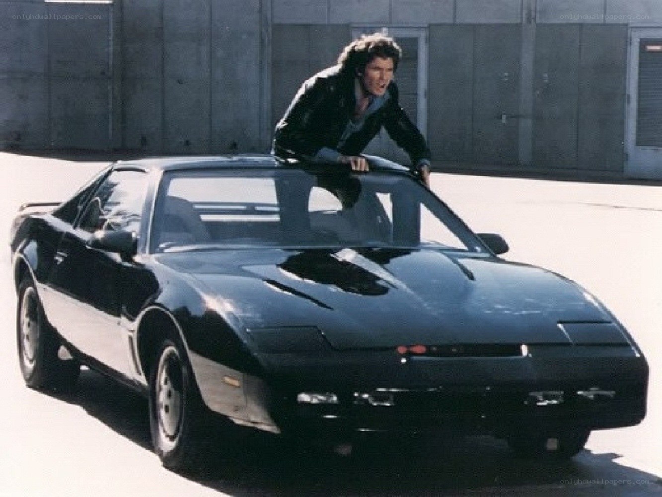 man on black car hood