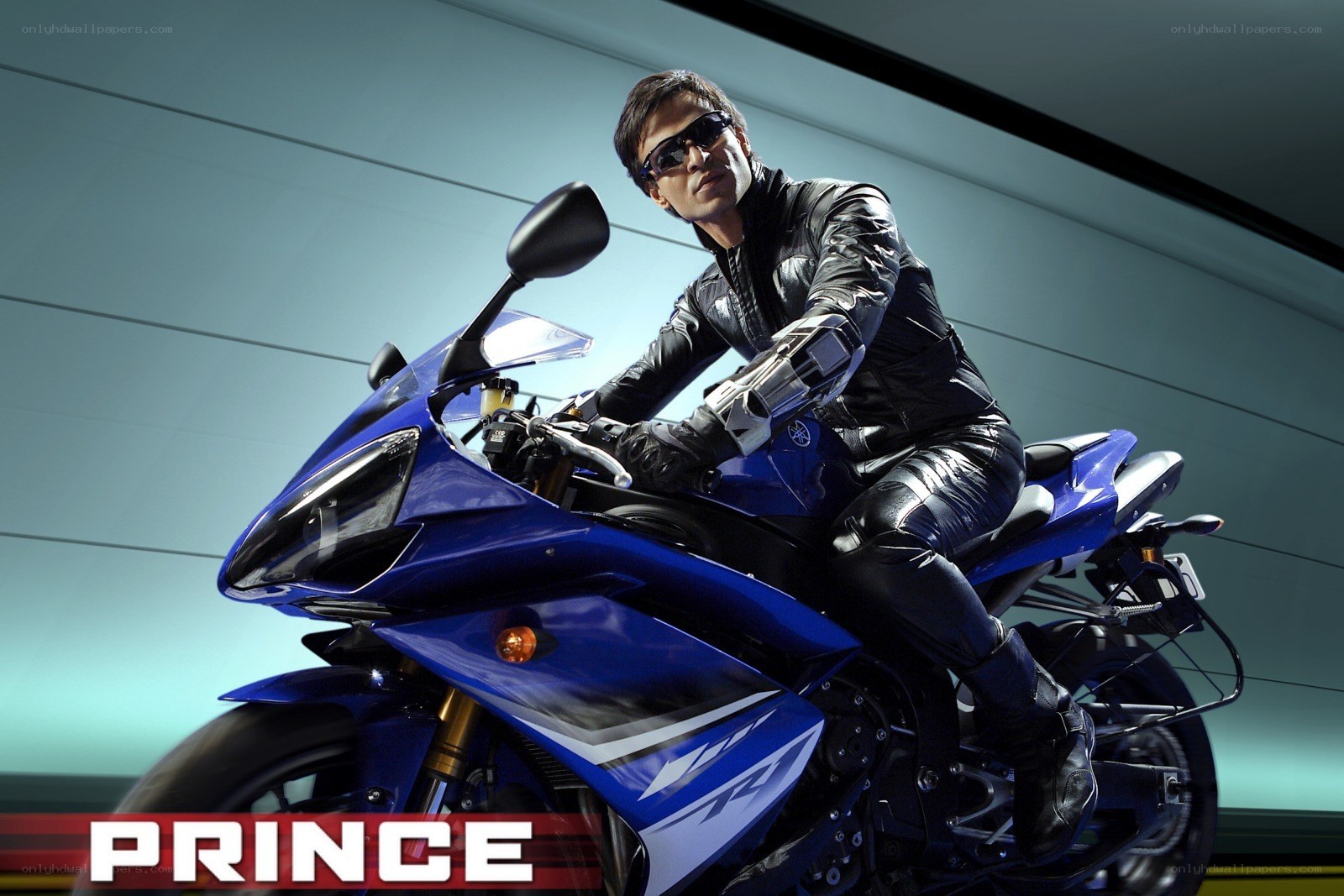 Man on blue motorcycle