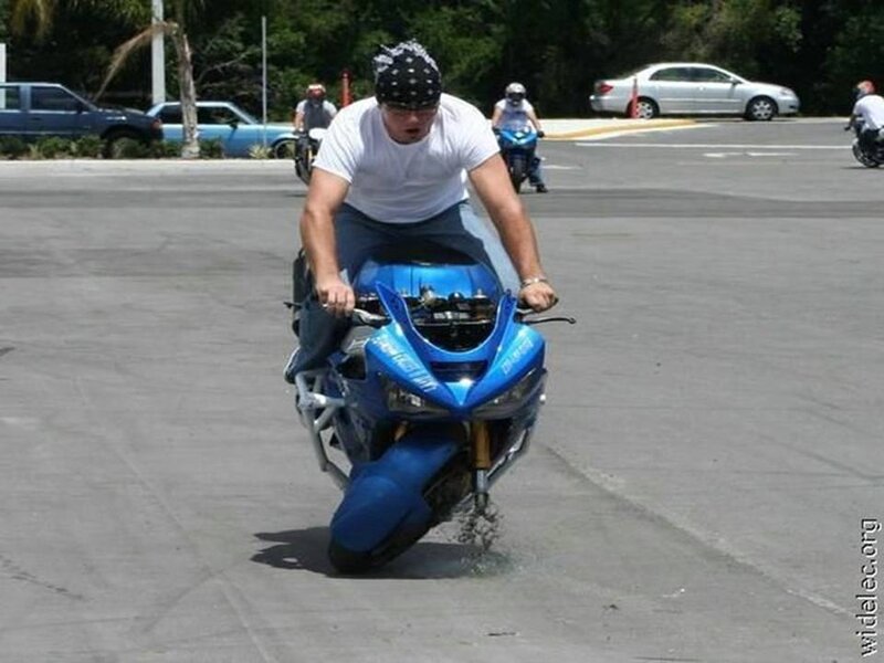 Man on Blue Motorcycle — Active