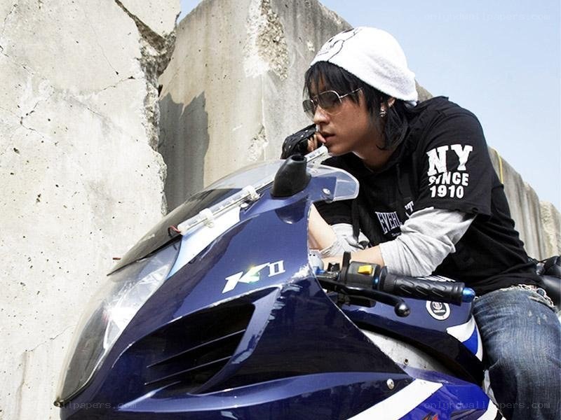 man on blue motorcycle
