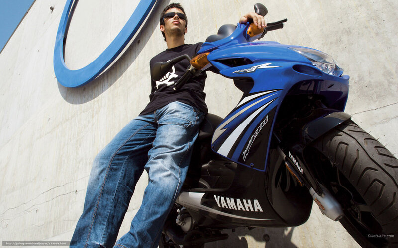 Man on Blue Scooter — Confident