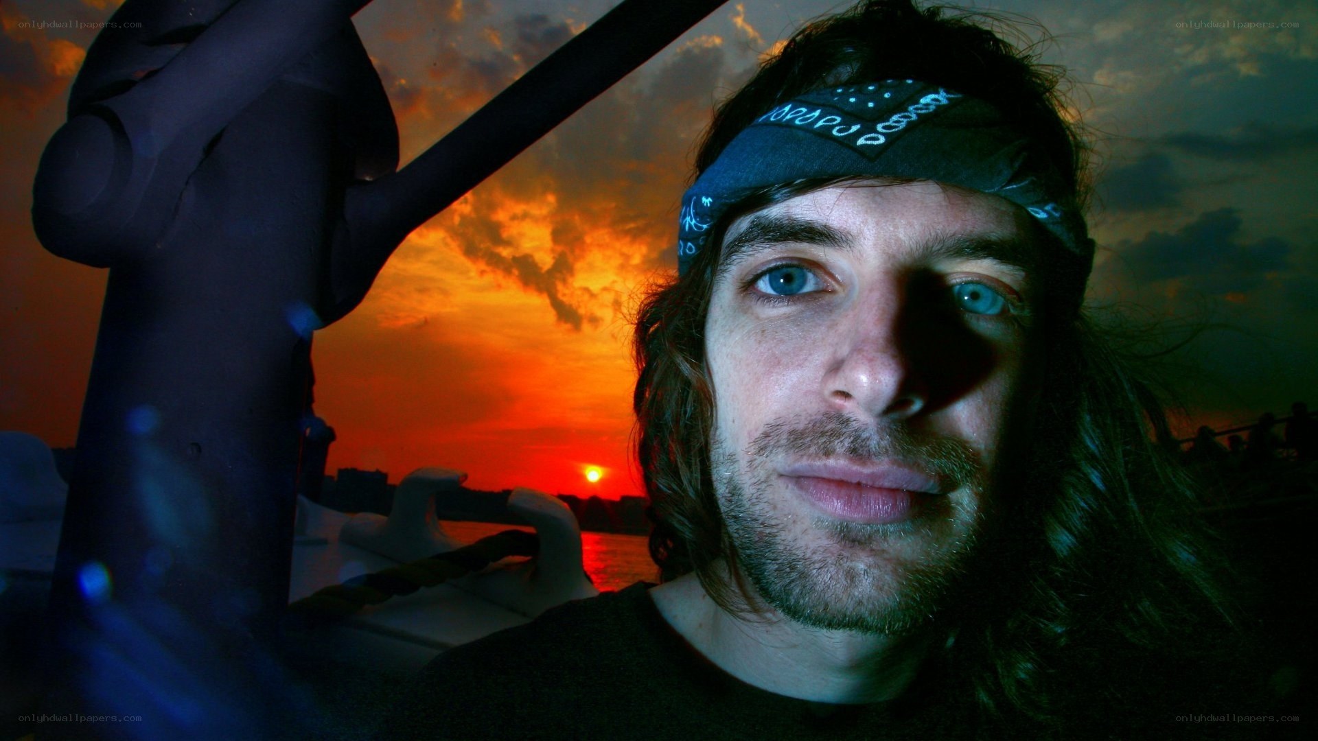 man on boat at sunset