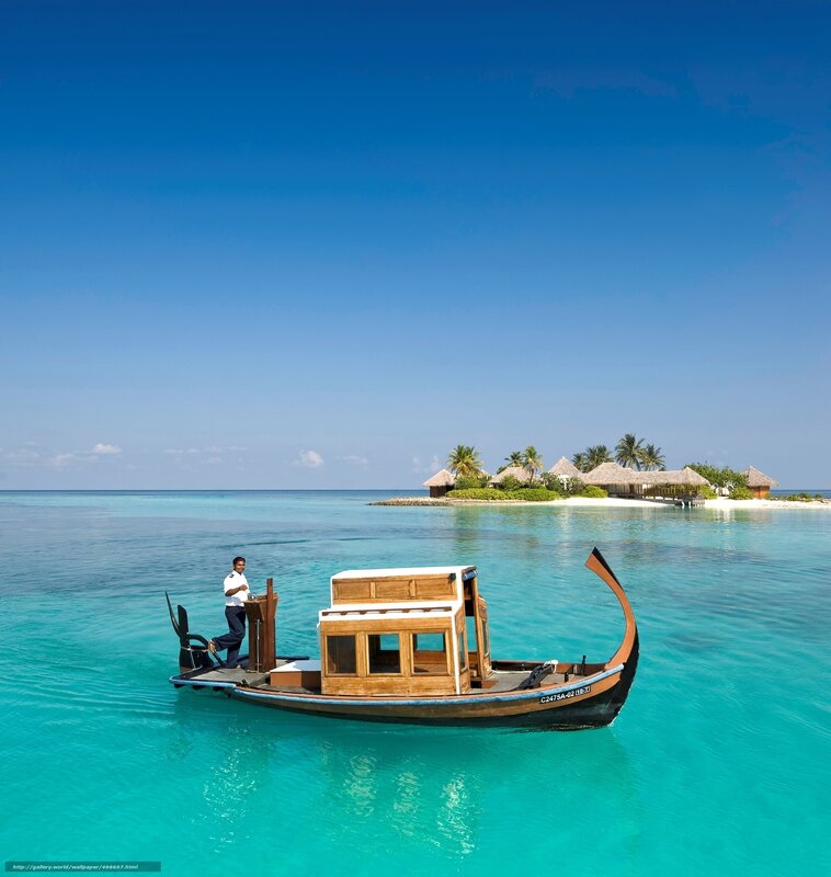 Man on boat near tropical island
