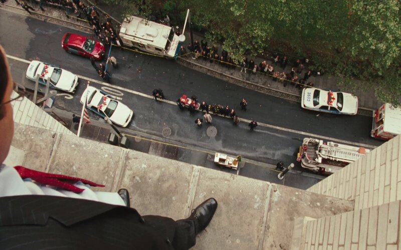 Man on Building Ledge