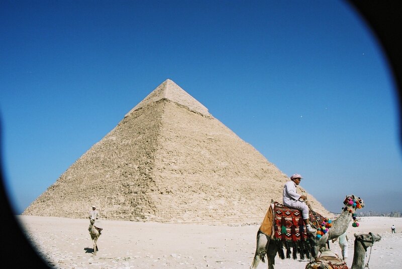 Man on Camel Near Pyramid — Blue