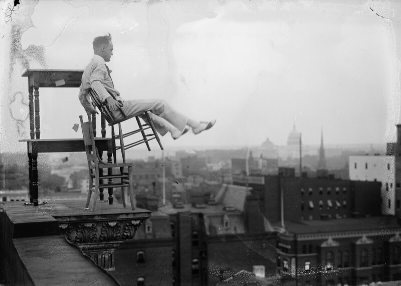 Man on Chair on Rooftop