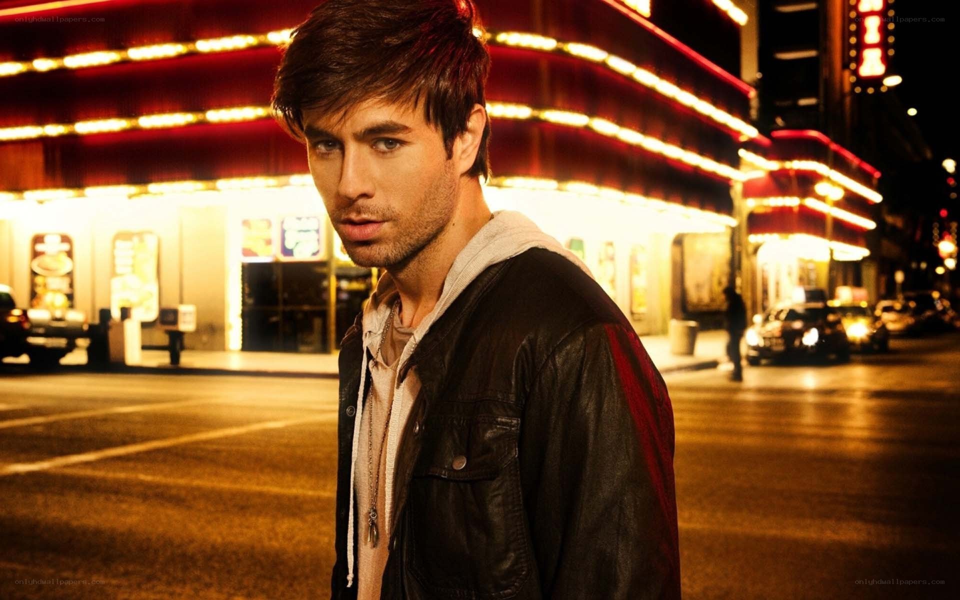 man on city street at night