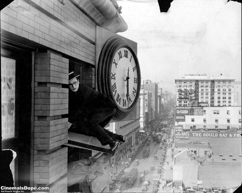 Man on clock ledge in city