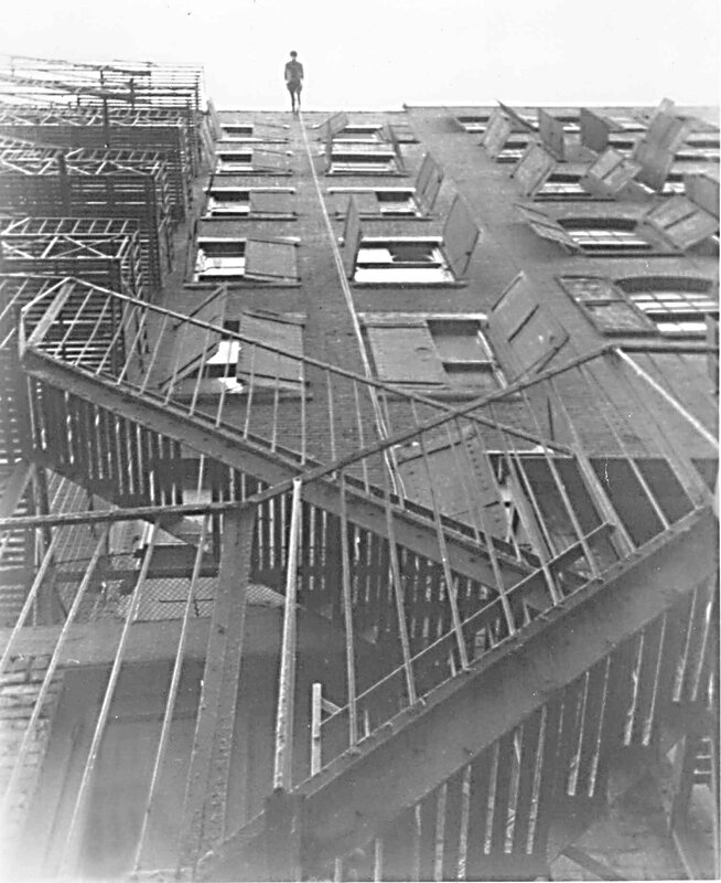 Man on damaged rooftop