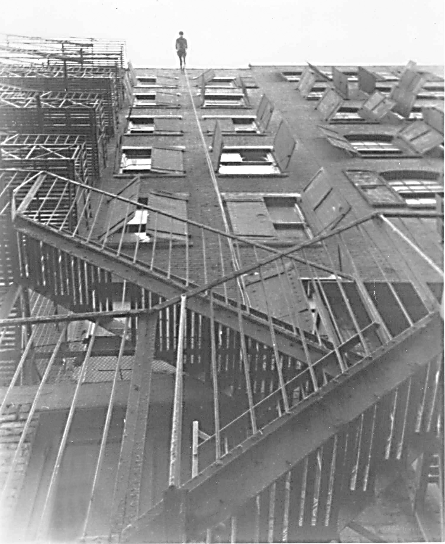 Man on damaged rooftop